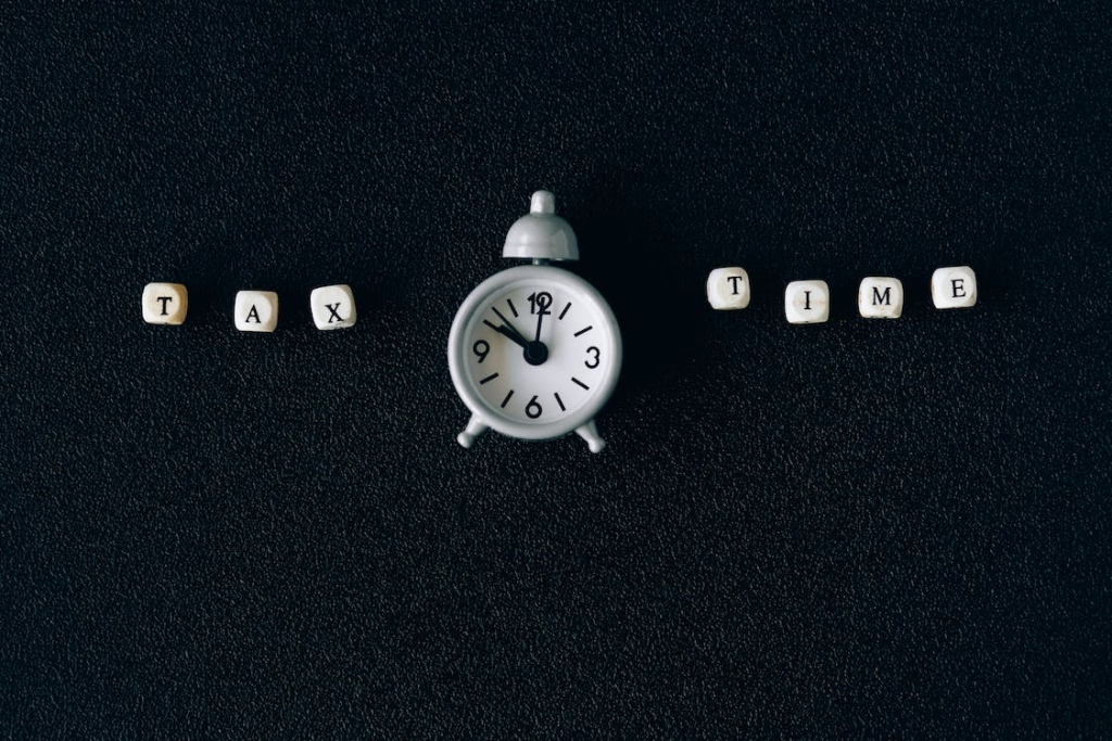 Tax time written next to an alarm clock
